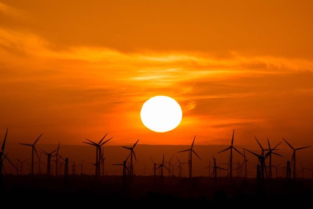 wind turbines and a sun top benefits of solar energy